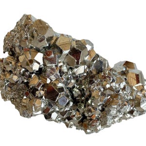 May include: A cluster of pyrite crystals, also known as fool's gold, with a metallic, reflective surface. The crystals are a mix of geometric shapes and have a golden-silver color. The mineral specimen is set against a white background.