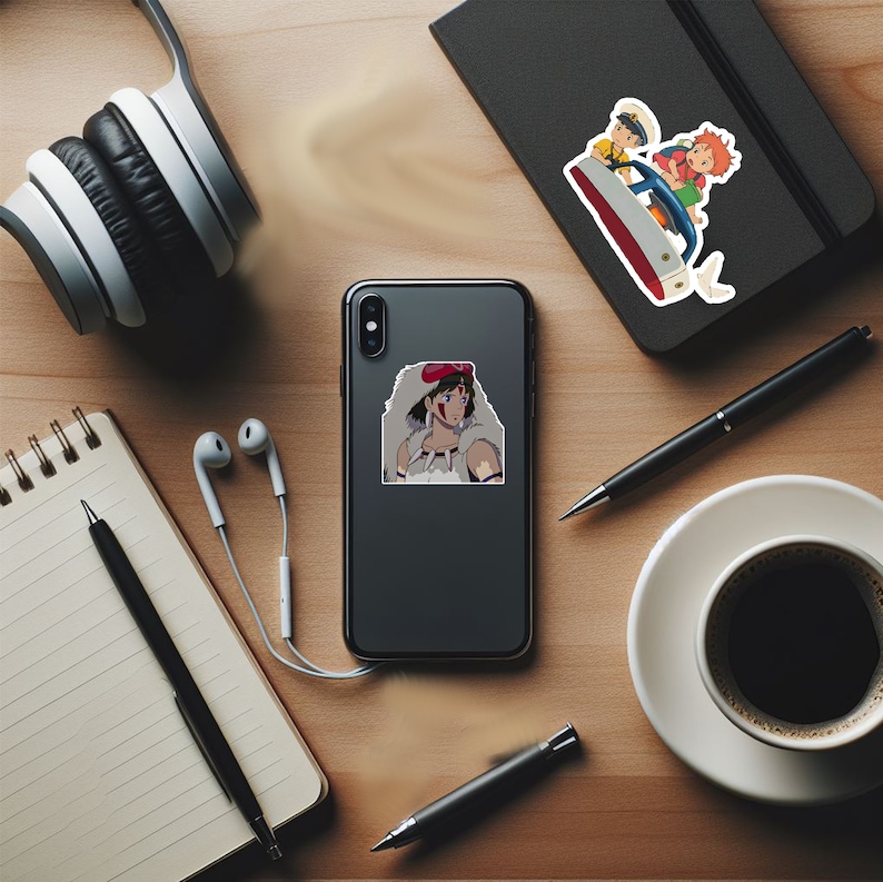 May include: A black smartphone with a white case featuring a sticker of a female anime character with red hair and a white wolf fur coat. The character is wearing a red headband and has a red mark on her face.