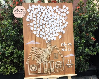 Può includere: Un cartello di legno con una casa e palloncini, decorato per un matrimonio. Il cartello dice "Tien Vu & Mai Ly" e "21 gennaio 2024".