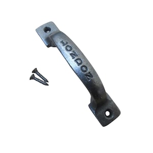 May include: A cast iron door handle with the word "LONDON" embossed on the handle. The handle is dark gray and comes with two black screws. The handle is designed for easy installation and adds a vintage touch to any door or drawer.