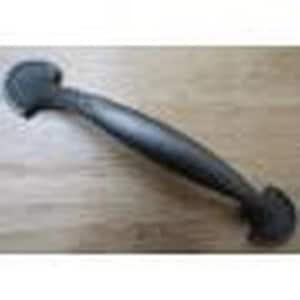 May include: A dark grey metal cabinet pull with a curved handle and decorative ends. The hardware is designed for furniture and has a rustic, vintage appearance. The pull is shown against a light wood surface.
