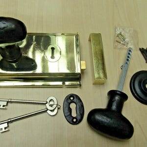 6'' Brass Rim Lock and Black Oval Knob