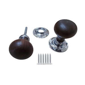 May include: Two dark brown wooden door knobs with chrome bases and a set of screws. One knob is assembled, the other is disassembled. The knobs have a classic, rounded design.