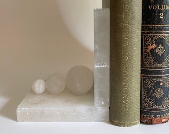 Vintage mid-century pair of white bookends with sculptural detail