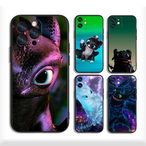 May include: A collection of five phone cases featuring dragon-themed designs. The cases showcase various dragon illustrations in shades of black, blue, green, and purple. Each case has a black border and a camera cutout.