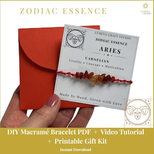 May include: A red envelope and a white card featuring the text Zodiac Essence Aries Carnelian Vitality Courage Motivation Made by Hand Given with Love. A red string bracelet with small orange and red carnelian stone chips is attached to the card.