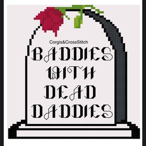 May include: Cross-stitch design featuring a tombstone with the text "BADDIES WITH DEAD DADDIES" in black gothic lettering. A red rose and green leaves are at the top. The text "Corgis&CrossStitch" is above the tombstone.