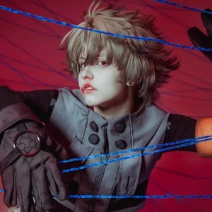 May include: A person with short, light-colored hair and red eyes wearing a grey vest over a black long-sleeved shirt, black gloves with circular emblems, and a tan arm band. The person is positioned behind several thin, bright blue horizontal strings.