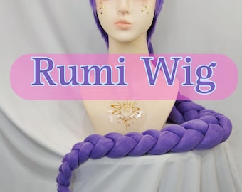 May include: A vibrant purple wig styled with a top knot and a long, thick braid that extends downward. The wig is displayed on a mannequin head featuring gold star accents on the cheeks and a sun emblem on the chest. The text Rumi Wig is visible.