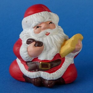 Small Ceramic Santa Claus Ornament holding a book - Santa Figurine Decoration