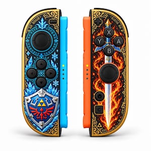 May include: Two game controllers featuring gold trim and intricate designs. The left controller is blue with a shield emblem and crystal motifs. The right controller is orange with a central sword graphic surrounded by flames and action buttons.