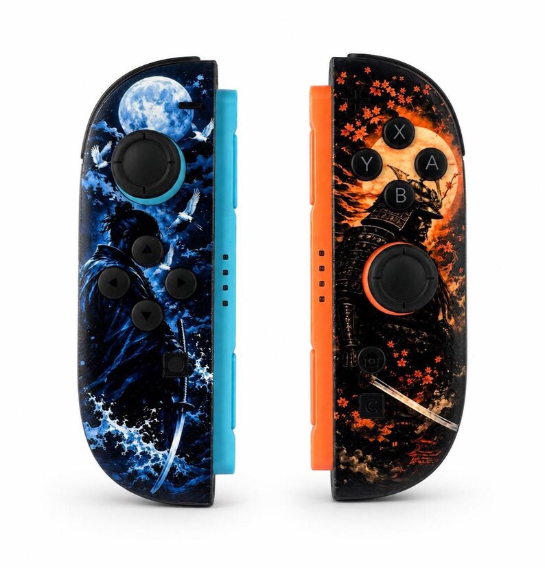 May include: A pair of game controllers featuring custom skins. The left controller has a blue side rail and a blue-toned graphic of a samurai with a sword and a full moon. The right controller has an orange side rail and an orange-toned graphic of a samurai with a sword and falling maple leaves.