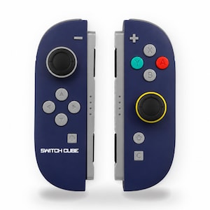 May include: A pair of dark blue game controllers with gray side rails. The left controller features a black joystick, a directional pad, a minus button, and the text SWITCH CUBE. The right controller has a black joystick with a yellow ring, A, B, X, Y buttons, a plus button, and home and C buttons.
