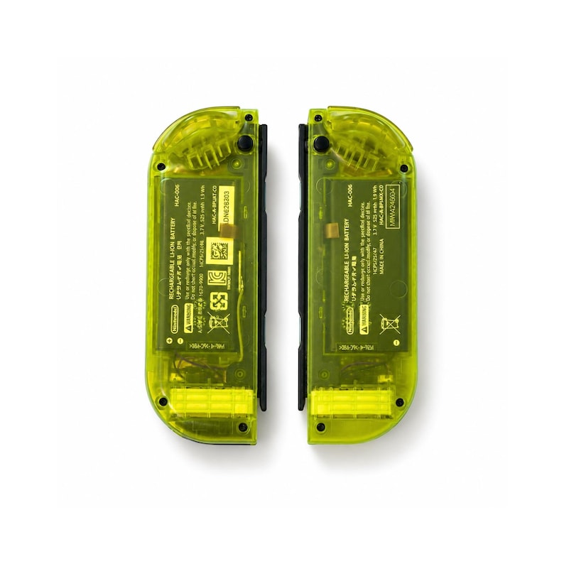 May include: Two neon yellow translucent game controllers with visible internal battery packs. Each controller features black buttons, a black side rail, and printed text including "RECHARGEABLE LI-ION BATTERY" and "Nintendo" on the internal labels.