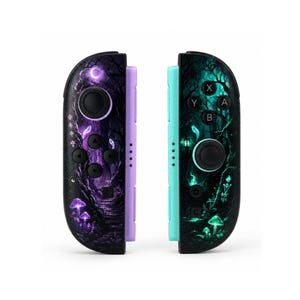 May include: A pair of game controllers featuring a custom skin with a dark forest theme. The left controller has purple accents and a crescent moon, while the right controller has teal accents and buttons labeled A, B, X, and Y with glowing mushrooms.