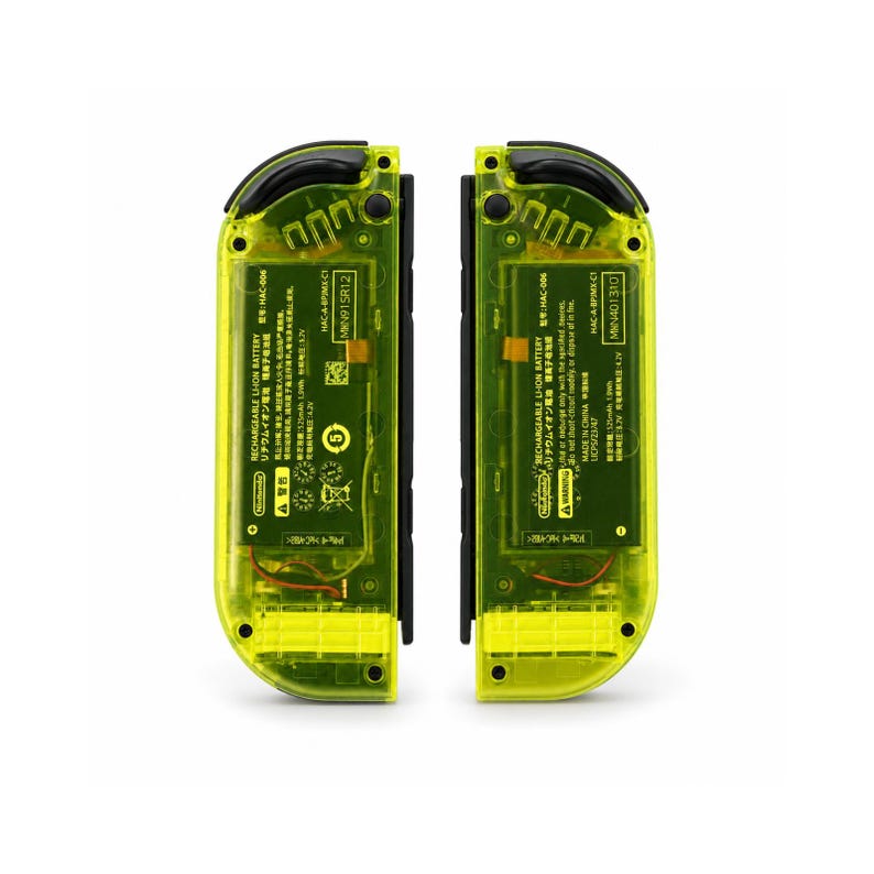 May include: Two neon yellow translucent game controllers with visible internal components, including a rechargeable lithium-ion battery pack labeled with technical specifications, black buttons, and black side rails, presented against a plain white background.