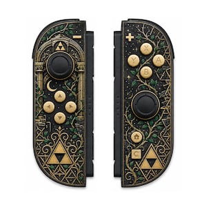 May include: A pair of black game controllers featuring intricate gold and green botanical designs, arched architectural motifs, a crescent moon, and the golden Triforce symbol. The controllers include black joysticks and gold-colored buttons.
