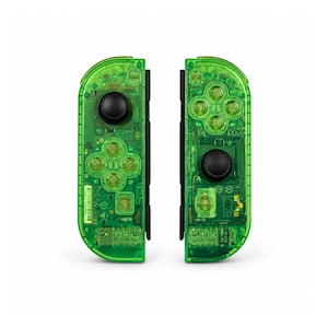 May include: Two neon green game controllers, each with a black joystick and buttons. The transparent design reveals the internal circuitry. The controllers are designed for a gaming console.