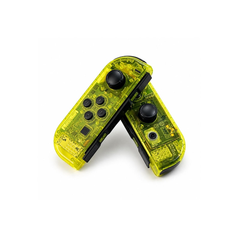 May include: Two wireless video game controllers with a translucent neon yellow plastic shell. Each controller features a black circular joystick, a set of black directional buttons, and visible internal electronic components through the casing.