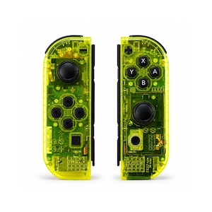 May include: A pair of neon yellow translucent game controllers featuring visible internal circuitry, black analog sticks, and black directional buttons. The right controller displays A, B, X, and Y buttons, while the left controller features a directional pad.
