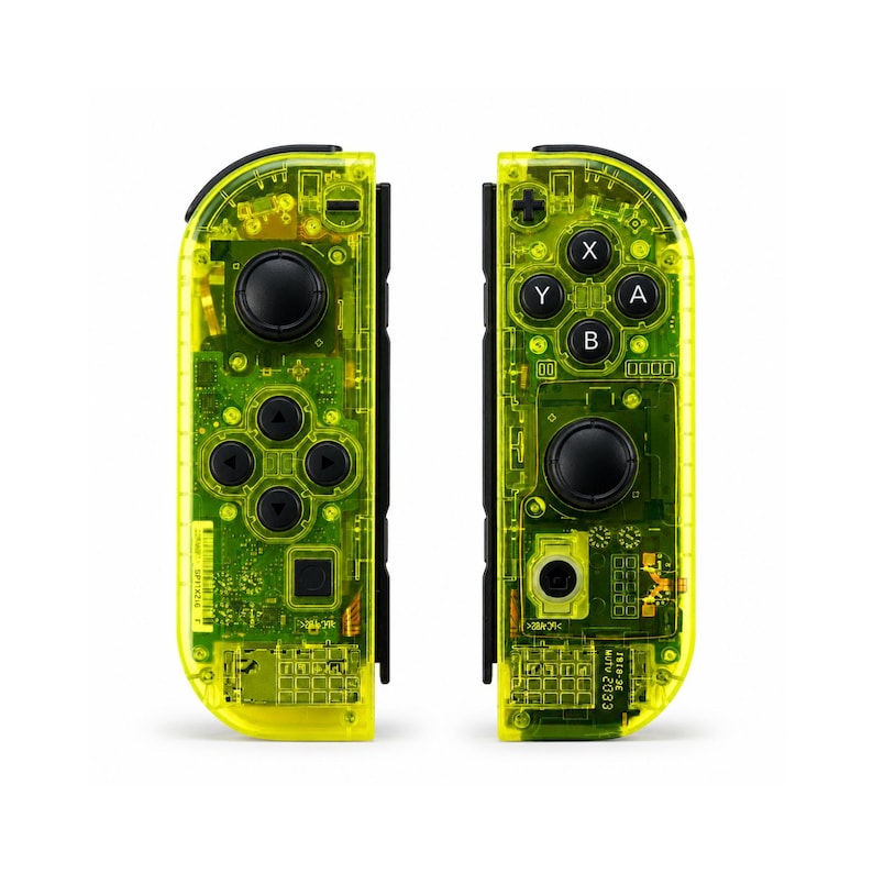 May include: A pair of neon yellow translucent game controllers featuring visible internal circuitry, black analog sticks, and black directional buttons. The right controller displays A, B, X, and Y buttons, while the left controller features a directional pad.
