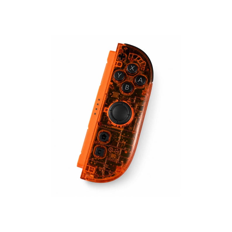 May include: A right-side video game controller featuring a translucent orange plastic shell that reveals internal electronic components. The device includes a black circular joystick, four action buttons labeled A, B, X, and Y, and two smaller buttons.