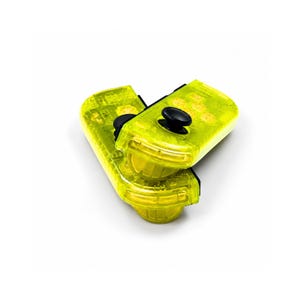 May include: A pair of neon yellow game controllers featuring a translucent plastic shell that reveals internal components. Each controller includes a black circular joystick, a set of four circular buttons, and additional side-mounted buttons.