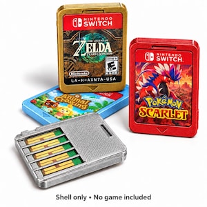 May include: A collection of four Nintendo Switch game cartridge shells in gold, red, and blue. The shells feature labels for The Legend of Zelda: Tears of the Kingdom, Pokémon Scarlet, and Animal Crossing: New Horizons. One silver shell is shown from the back.