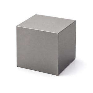 May include: A solid, metallic cube with a smooth, matte gray finish. The object features sharp, clean edges and flat, uniform surfaces on all visible sides, presenting a geometric form with a consistent, neutral tone and a reflective, polished appearance.