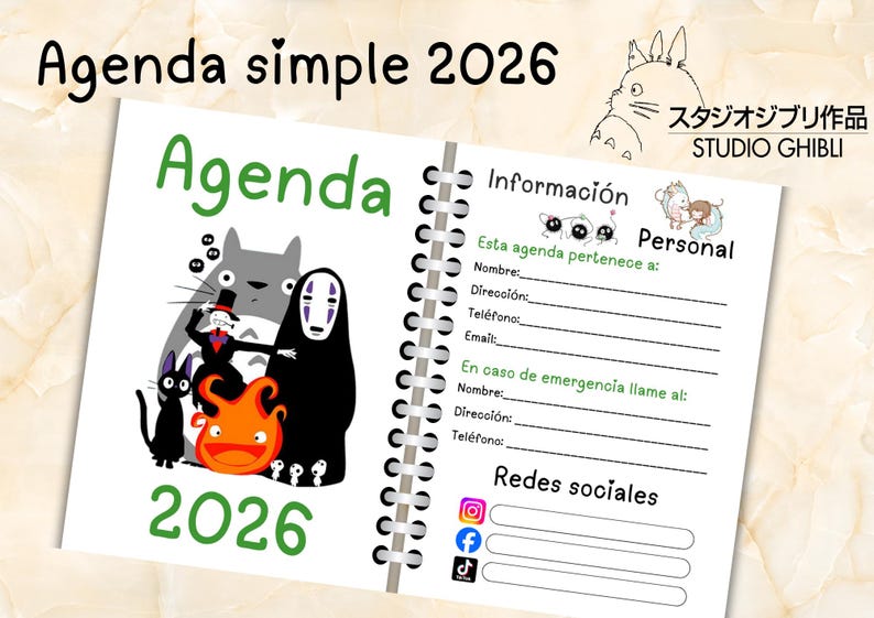 May include: A spiral-bound 2026 agenda with a white cover featuring illustrations of characters from Studio Ghibli films. The cover includes the text "Agenda" in green and "2026" in green. The agenda includes personal information sections.
