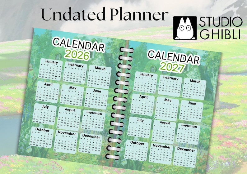 May include: An undated planner with a green and blue cover featuring a calendar for 2026 and 2027. The cover has a whimsical illustration of a forest scene with a house and a spiral binding.