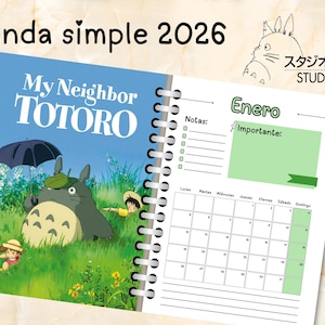 May include: A spiral-bound 2026 agenda featuring artwork from "My Neighbor Totoro." The cover displays the title and a scene with Totoro under an umbrella. The right page shows a calendar for January with space for notes.