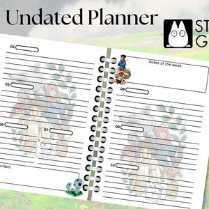 May include: An undated planner with a white background and black lines. The planner has a spiral binding and features illustrations of characters from Studio Ghibli films. The text "Undated Planner" and "Studio Ghibli" are printed on the cover.
