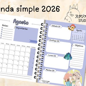 May include: Open planner with the text "Agenda simple 2026" and "Agosto" visible. The planner features a calendar, notes section, and illustrations of Studio Ghibli characters. The design is in shades of blue and white.