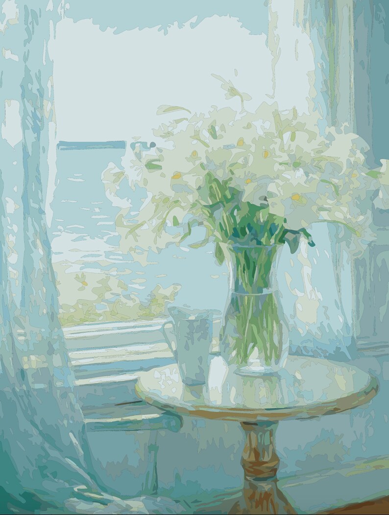 May include: A white vase filled with white flowers sits on a round wooden table with a white tablecloth. The table is next to a window with a view of the ocean.