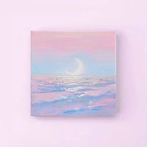 May include: A painting of a crescent moon over a sea of pastel pink, blue, and purple waves. The sky is a gradient of pink and blue, and there are small white stars scattered throughout the painting.