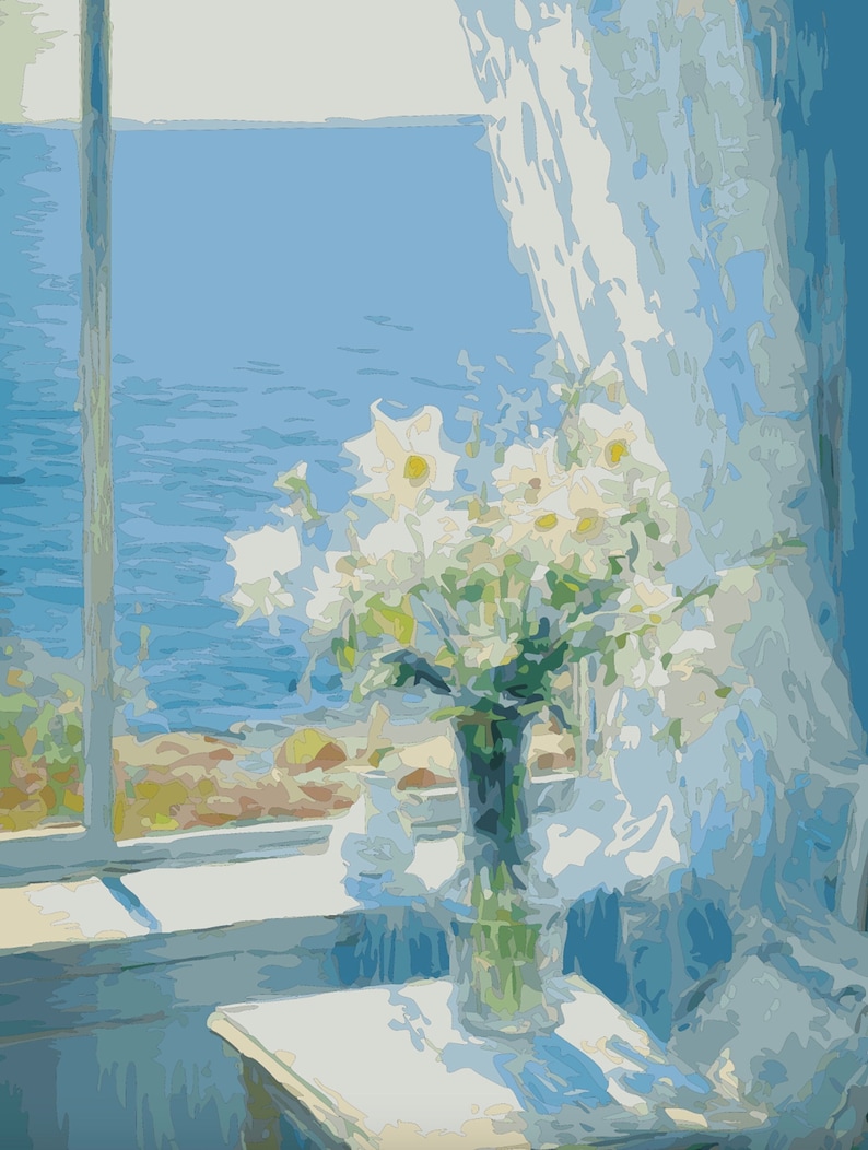 May include: A bouquet of white flowers in a clear glass vase sits on a white table in front of a window with a view of the ocean. The window is partially covered by a sheer white curtain.