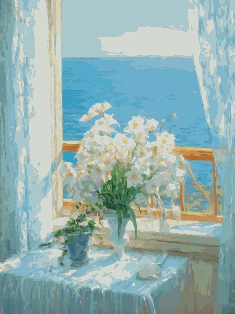 May include: A bouquet of white flowers in a white vase sits on a white tablecloth in front of a window with a view of the ocean. The window is open and the curtains are drawn back.