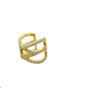 May include: Gold ear cuff with three rows of clear cubic zirconia stones.