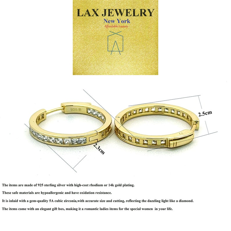 May include: Gold hoop earrings with a row of clear cubic zirconia stones around the perimeter. The earrings measure 2.3 cm in diameter and 2.5 cm in height.