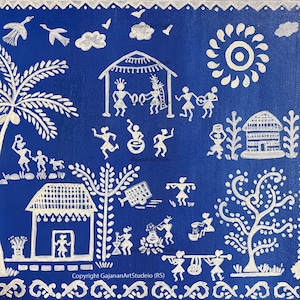 May include: A blue canvas painting with white tribal art depicting village life. The artwork includes figures, houses, trees, and a sun. The text "Copyright GajananArtStudio (RS)" is visible at the bottom.