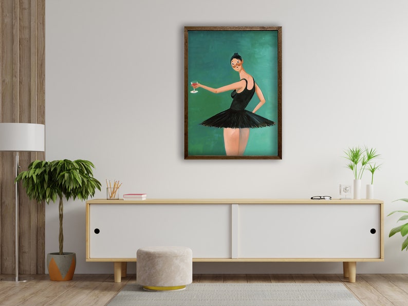 May include: A framed painting of a woman in a black tutu holding a glass of red wine. The background is a teal green color.