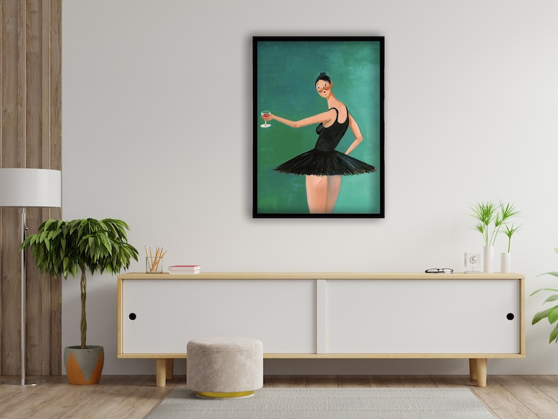May include: A framed painting of a woman wearing a black tutu and holding a glass of red wine. The background is a teal green color.