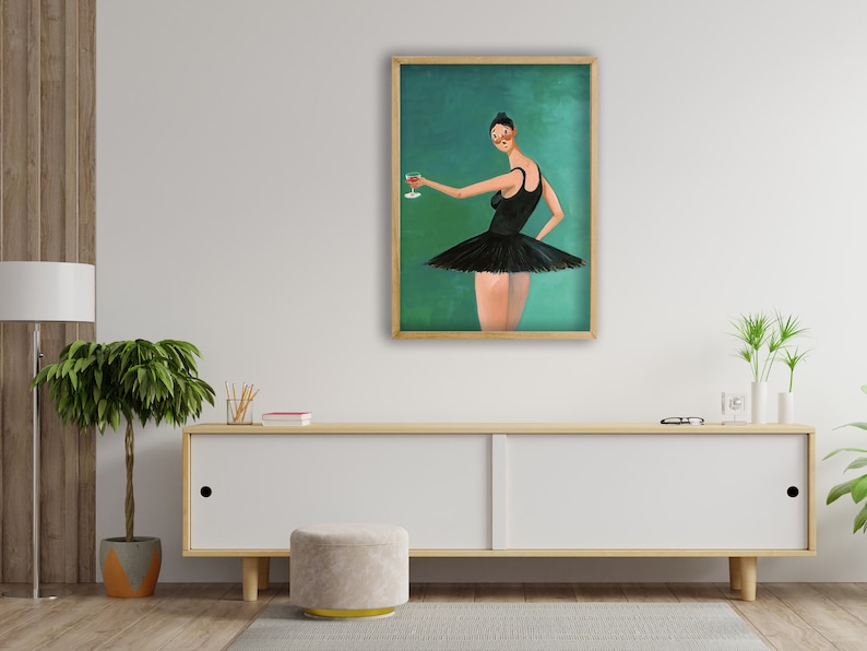 May include: A framed painting of a woman in a black tutu holding a glass of red wine. The background is a teal green color.