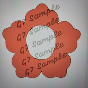 May include: A stylized orange flower shape with a white center. The flower has five rounded petals. The text "G7 Sample" is printed multiple times across the image.