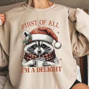 Funny Raccoon First Of All I'm A Delight Christmas Sweatshirt, Cute Christmas Raccoon Tee, Funny Christmas Gift, Cozy Xmas Women Sweater