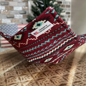 May include: A red, white, and blue patterned fabric pot holder with a label that reads "Handmade by FlourishProvisions".