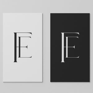 May include: Two cards, one white and one black, each with a stylised black and white letter "E" in the centre.