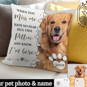 May include: White pillow with a brown paw print and the text "When you miss me have no fear hug this pillow and know I'm here" with a golden retriever dog image and the name "Henry" printed on the pillow.