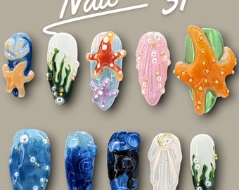 May include: Ten different nail art designs featuring a variety of themes, including seashells, starfish, and seaweed. The designs are painted on a light gray background. The text "Nail 31" is written in black at the top of the image.